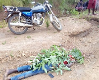 The deceased lying in pool of blood