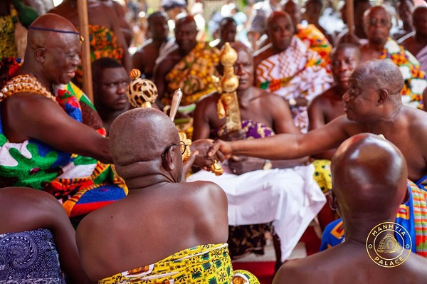 Otumfuo shaking hands with some of the attendees