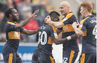 Newcastle United's Atsu is congratulated by Jonjo Shelvey after scoring his side's first game