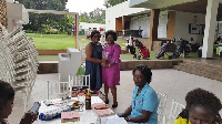 Madam Peace Akwei (L) receiving her prize from Esther Amedzro, GLGU president