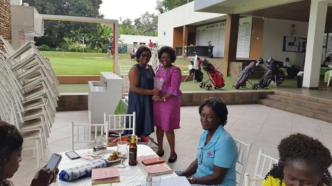 Madam Peace Akwei (L) receiving her prize from Esther Amedzro, GLGU president