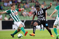 Samuel Tetteh tries to beat two defenders