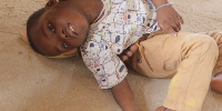 A photo of the 3-year-old child with a spinal cord problem