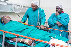 Former president John Dramani Mahama with a victim of the gun attack and violence