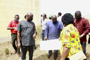 Minister of Works and Housing, Francis Asenso-Boakye and team at the site