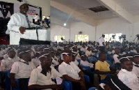 Alhajj Maulvi Noor Mohammed Bin Salih(in shot) addressing some students