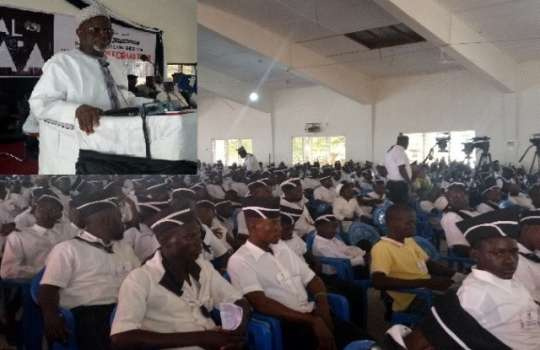 Alhajj Maulvi Noor Mohammed Bin Salih(in shot) addressing some students