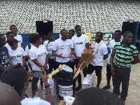 Abeiku Santana with members of Guba donating the items