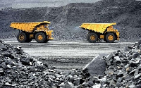 Some trucks at a mining field