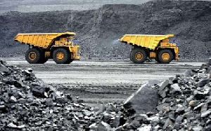 Some trucks at a mining field