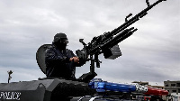 A soldier mans a weapon during a security patrol in Tripoli's Tajura neighbourhood.