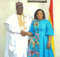 Shirley Ayorkor Botchwey (right) in a handshake with Olufemi Michael Abikoye