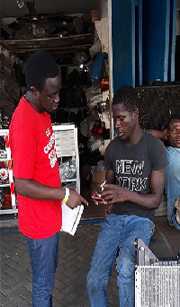 A spare parts dealer being taught how to use the Car Master Bundle