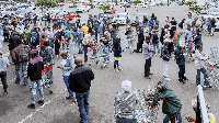 Hundreds of people line up to stock up on supplies