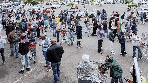 Hundreds of people line up to stock up on supplies