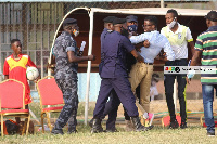 Coach Ignatius Osei-Fosu in a tussle with Police