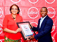 Kobla Nyaletey of Absa Ghana presenting the award to Dr. Jennifer Bruce-Konuah of Tullow Ghana