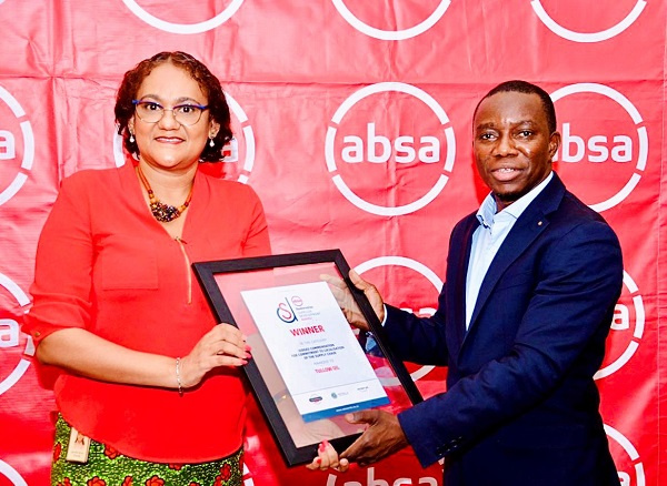 Kobla Nyaletey of Absa Ghana presenting the award to Dr. Jennifer Bruce-Konuah of Tullow Ghana