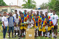 Some of the beneficiaries in a group photo with officials of  Soccer For Dreamers