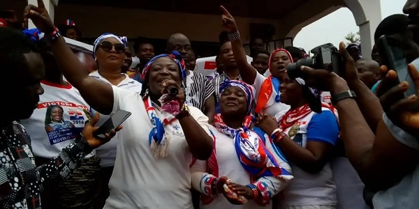 Abena Durowaa Mensah (holding a microphone) with some NPP supporters