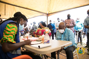 President  Nana Addo Dankwa Akufo-Addo acquiring his voter ID Card at a registration center in Kyebi