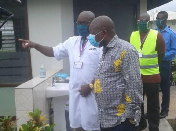 Kwaku Agyeman-Manu inspecting some health facilities