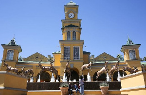 Visitors are seen at the entrance of Gold Reef City and casino in Johannesburg, South Africa