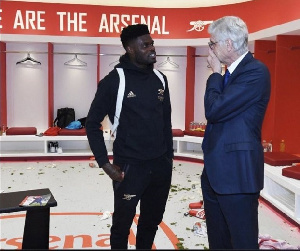 A photo of Thomas Partey and Arsene Wenger