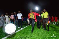 Asenso-Boakye kicks a ball to inaugurate the turf