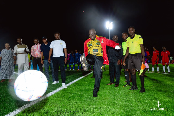 Asenso-Boakye kicks a ball to inaugurate the turf