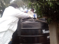 The laboratory technicians preparing the chlorine solution