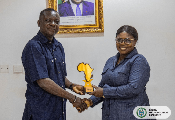 Mrs. Florence Kuukyi receiving her award