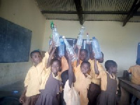 Some of the school pupils holding their bottled water