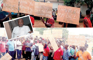 A section of the youth with their placards during a demonstration at Nyinahin [INSET] Ibrahim Mahama