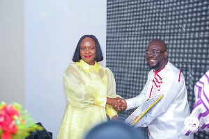 Ms. Patricia Ofori-Atta receiving her award