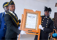 Captain George Yaw Buabeng (R) receiving the chatter of Commandry