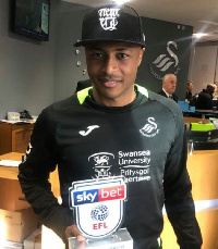 Andre Ayew with a Man Of The Match award at Swansea