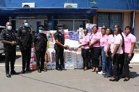 Members of AWAG and the police hospital with the donated items