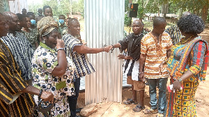 Dr. Nene Sipim Narh Terkpetey II (left) Presenting The Items To School Authorities.