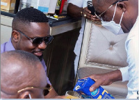 Ghanaian Rapper Sarkodie being served by Dr. Osei Kwame Despite