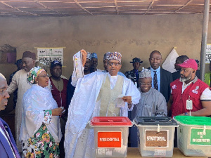 President Muhammadu Buhari, his wife casting their ballot