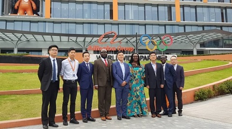 Ursula Owusu-Ekuful in a group photograph with officials of Whale Cloud after the signing ceremony