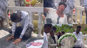 The family, dressed in white and black, visited his tomb for a solemn ceremony.