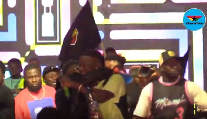 Shatta Wale and Stonebwoy hugging each other on stage