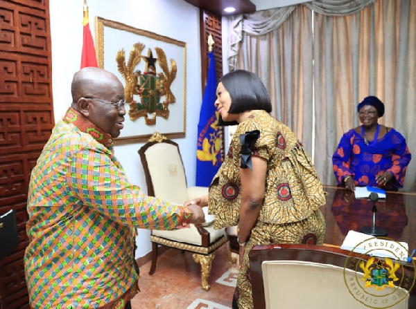 President Nana Akufo-Addo in a handshake with EC Chair, Jean Mensa