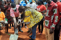 Mrs Freda Prempeh cut the sod for work to begin on the pavement of the Bomaa Lorry station