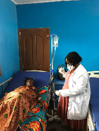 Agnes Attah Amofa, Physician Assistant at the health center attends to a patient