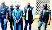 Suspected kidnap kingpin, Hamisu Bala Wadume (in handcuffs)