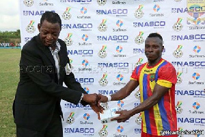 Patrick Razak receiving his NASCO Man of the Match award from the Match Commissioner.