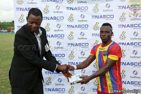 Patrick Razak receiving his NASCO Man of the Match award from the Match Commissioner.